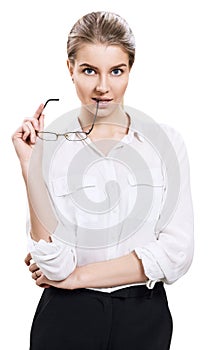 Attractive businesswoman holds glasses in hands.