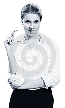 Attractive businesswoman holds glasses in hands.