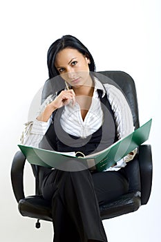 Attractive businesswoman in office chair