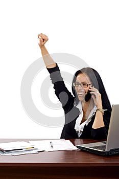 Attractive businesswoman on the phone winning