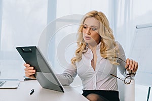 attractive businesswoman reading documents