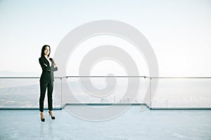 Attractive businesswoman on rooftop
