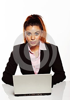 Attractive businesswoman sitting at her desk