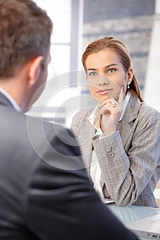 Attractive businesswoman sitting in office