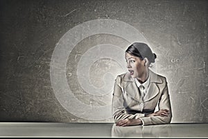 Attractive businesswoman sitting at table