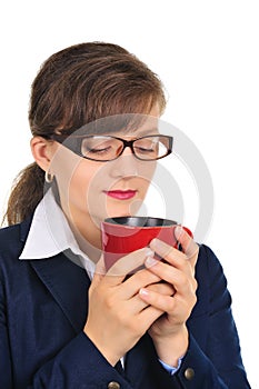 Attractive businesswoman smelling coffee