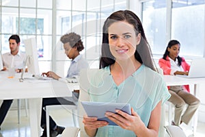 Attractive businesswoman with tablet pc