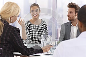 Attractive businesswoman talking at a meeting