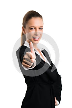 Attractive businesswoman with thumb up gesture