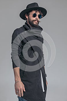 Attractive casual man wearing a cardigan, sunglasses
