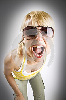 Attractive casual woman screaming