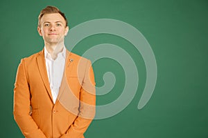 Attractive caucasian adult male wearing orange jacket