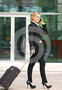 Attractive caucasian business woman talking on mobile phone