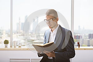 Attractive caucasian businessman with notepad