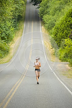 Attractive Caucasian Female Runner on Country Road