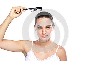 Attractive caucasian model using hair comb