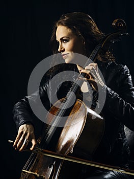 Attractive cello player playing her instrument