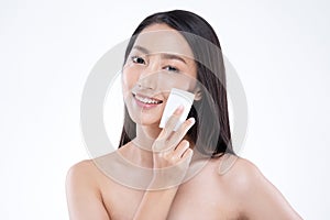 Attractive Charming Asian young woman smile and using tissue or cotton with toner cleaning make up so fresh and clean with healthy