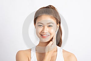Attractive Charming Asian young woman smile and using tissue with toner for cleaning make up feeling so fresh and clean with healt