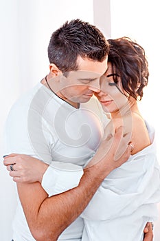 Attractive cheerful man and woman hugging. couple cuddling, love and romence concept photo