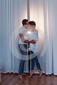 Attractive cheerful man and woman hugging. couple cuddling, love and romence concept photo