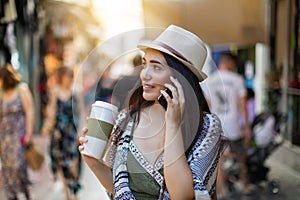 Attractive city hipster woman walking in the street