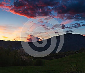 Attractive colorful sunset with cloudy sky in rural area