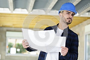 attractive and confident constructor working indoors