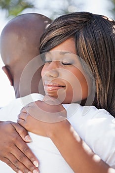 Attractive couple embracing in their garden