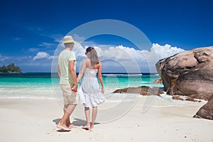 Attractive couple enjoying sunny day at Baie Lazare Beach. Mahe, Seychelles