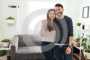 Attractive couple feeling happy after getting their new house