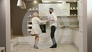 Attractive Couple Having Fun Together Dancing In The Kitchen