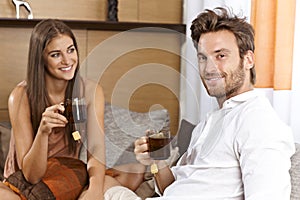 Attractive couple having tea at home