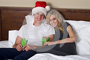 Attractive couple opening Christmas gifts