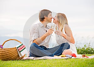 Attractive couple on romantic afternoon picnic