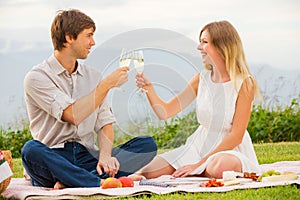 Attractive couple on romantic afternoon picnic