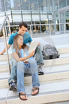 Attractive Couple at School Library Reading