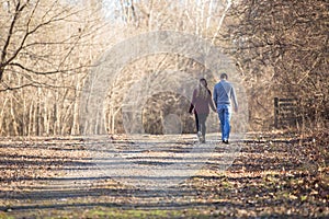 Attractive couple walking holing hands