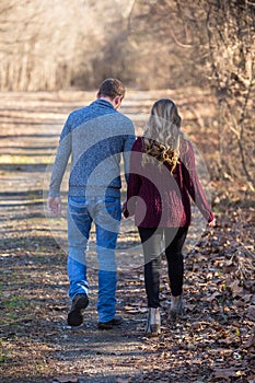 Attractive couple walking holing hands