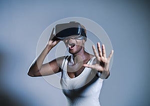 attractive curious black afro american woman wearing VR 3d visio