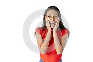 Attractive dark-haired Latin woman with hands cupping her face and panicky expression on a pure white background. Studio