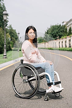 Attractive disabled woman in wheelchair 
