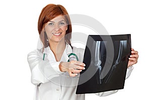 Attractive doctor looking a radiography