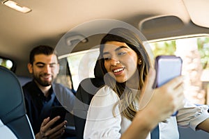 Attractive driver working on a rideshare app