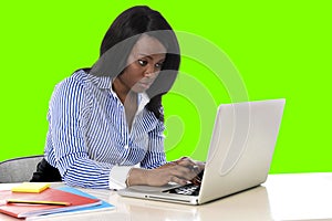 Attractive and efficient black ethnicity woman at office isolated green chroma key screen