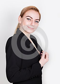 Attractive and energetic business woma in a suit on naked body smiling