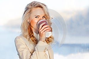 Attractive european woman drinking coffee relaxing in break at work