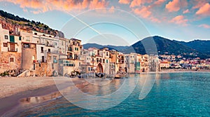 Attractive evening cityscape of Cefalu town. Amazing sunset on Mediterranean sea, Sicily, Italy, Europe.