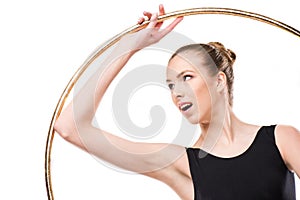 Attractive excited rhythmic gymnast in leotard with hoop
