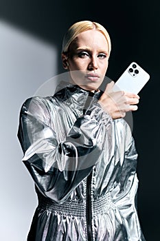 attractive extravagant woman in futuristic silver